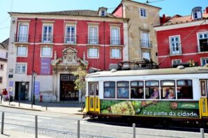 Best of Lisbon Walking Tour: Rossio, Chiado & Alfama - Rossio to Restauradores: independence, obelisks, and turning points