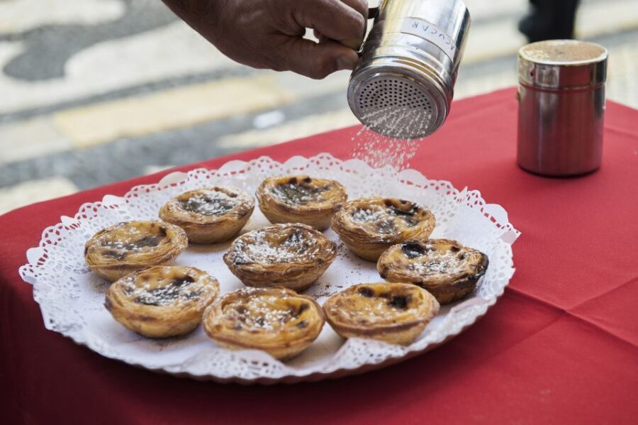 Best of Lisbon Walking Tour: Rossio, Chiado & Alfama - Tastings that actually feed the tour: pastel de nata, snack, and wine