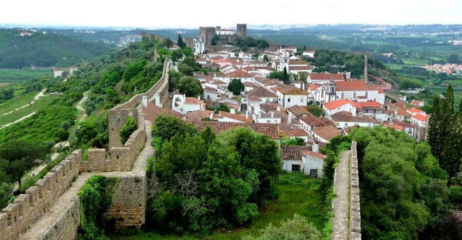 Fátima, Nazaré, and Óbidos: Small Group Tour From Lisbon - Óbidos inside the walls: cobblestones, flowers, and a chocolate cup ginja moment