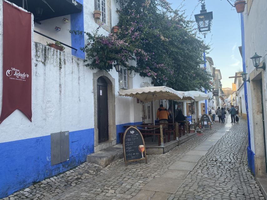 From Lisbon: Fátima, Batalha, Nazaré, and Obidos Tour by Van - Óbidos Castle and medieval lanes: the sour-cherry ritual in a chocolate cup