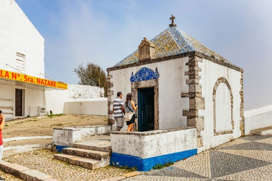 From Lisbon: Fatima Batalha Nazaré & Óbidos Small-Group Tour - Nazaré Cliff Views, Lighthouse Stop, and Time in the Fishing Village