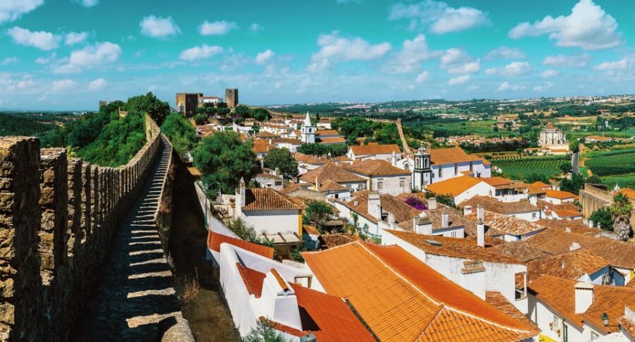 From Lisbon: Nazare Big Waves and Óbidos Guide Day Trip - What to eat and sip in Óbidos: ginjinha in a chocolate cup