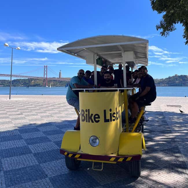 Lisbon: 1-Hour Beer or Sangria Bike Sightseeing Tour - Drinks, music, and the onboard bar vibe
