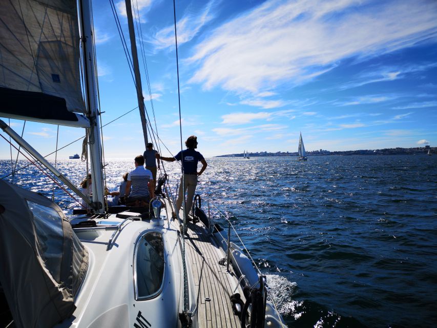 Lisbon: 2-Hour Sailing Yacht Cruise & Guided Tour w/2 drinks - Past the Ponte 25 de Abril and toward Terreiro do Paço