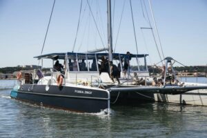 Lisbon: Catamaran Boat Party with Music, Open Bar & Dives - The Party Format: Music, Drinks, and a 3-hour River-to-Ocean vibe