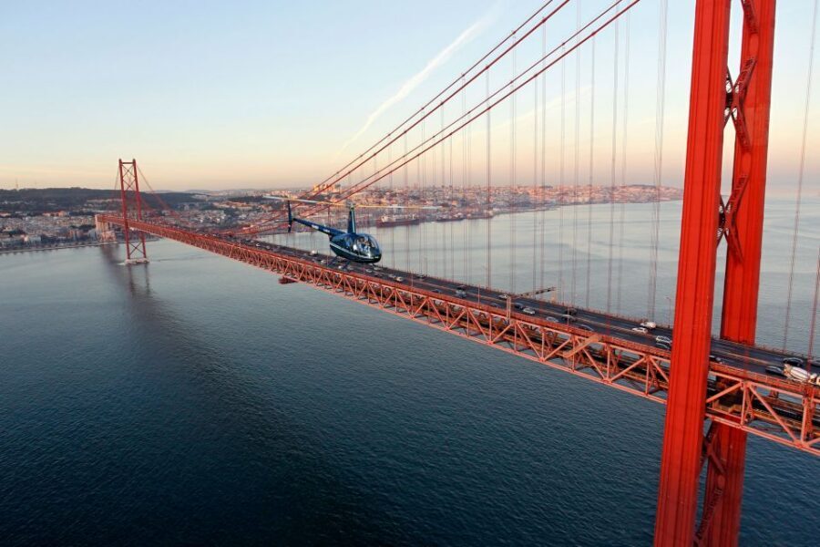 Lisbon: Helicopter Ride, Boat Trip, & Old Town Walking Tour - The yellow tram segment is paused, so focus on the viewpoint day