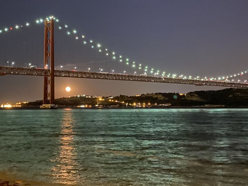 Lisbon: Luxury Sailboat Cruise at Night - Under the 25 de Abril Bridge: the moment the skyline opens up