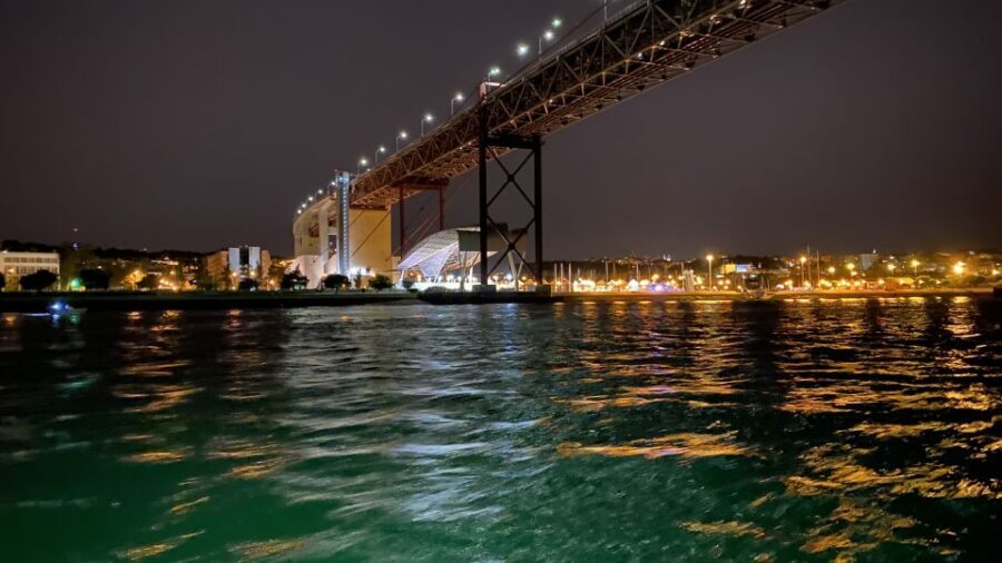 Lisbon: Luxury Sailboat Cruise at Night - Time Out Market Lisbon and Commerce Square: the city-center glow