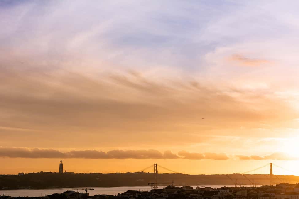 Lisbon: Private Sunset & Night Photo Walk - Alfama after dark: trams, alleys, and real atmosphere