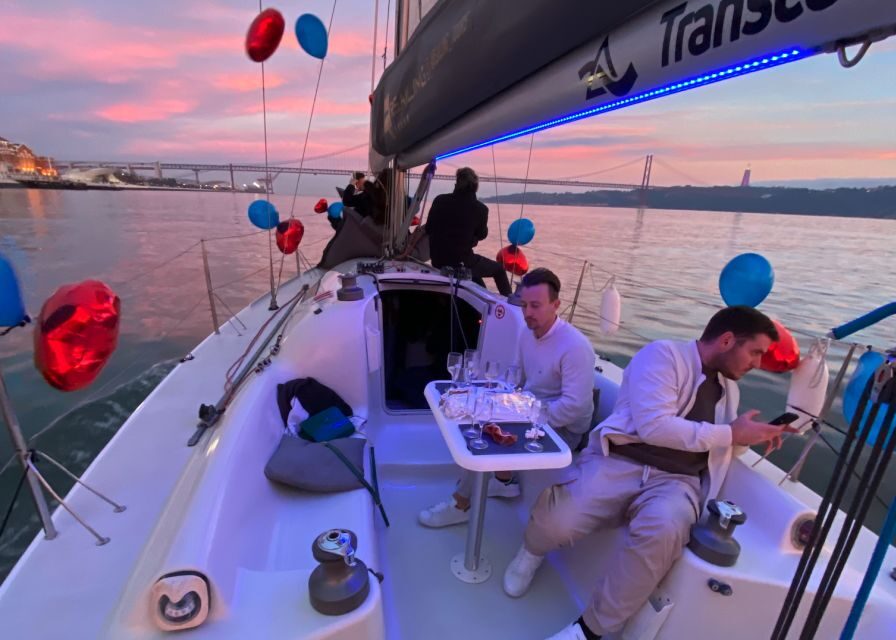 Lisbon: Sailboat Tour w/ Local Guide and Open Bar Green Wine - Under the 25 de Abril Bridge: Meeting Point and Tour Vibe