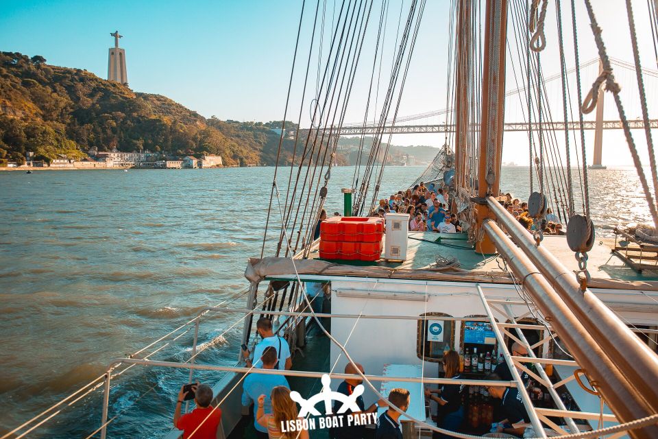 Lisbon: Sunset Boat Party with 2 Drinks and Free Club Entry - Christ the King pass: the skyline moment you’ll remember