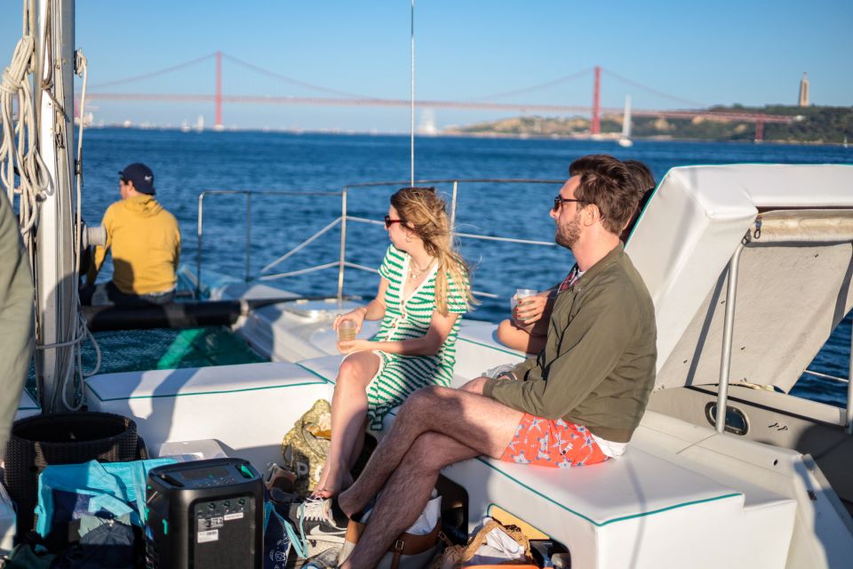 Lisbon: Sunset Catamaran Boat Tour with Music and Drinks - Nets, blankets, and staying comfortable after sunset