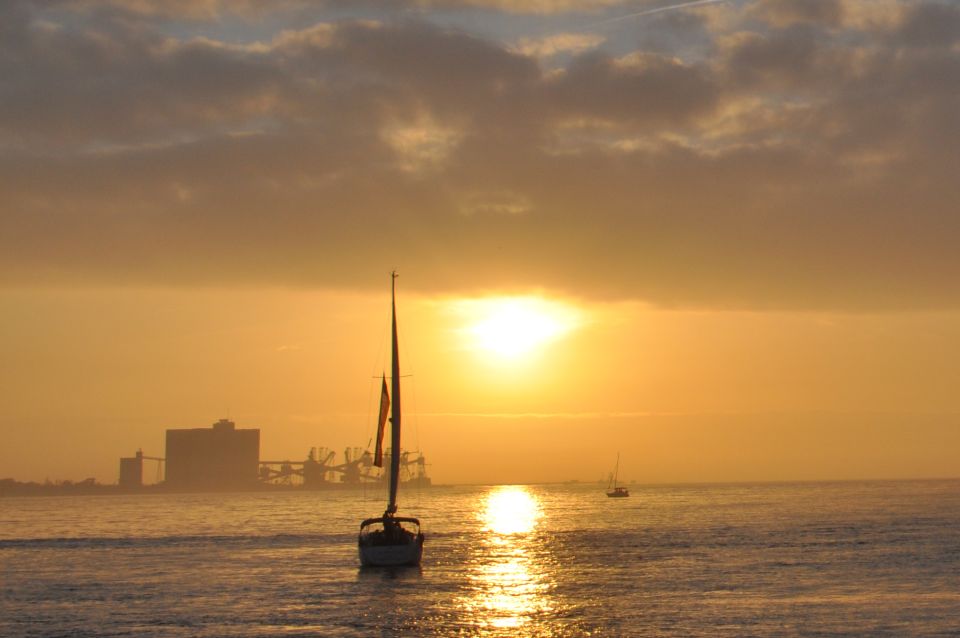 Lisbon: Sunset Cruise on The Tagus River with Welcome Drink - What the vibe feels like: music, wine, and a calm crowd