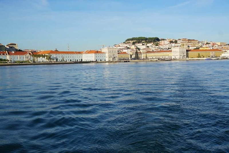 Lisbon: Sunset Sailing Boat Tour with Drinks - Onboard comfort: indoor lounge, bathroom, blankets, and bow-deck views