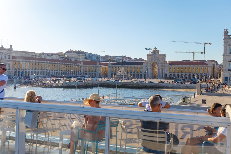 Lisbon: Tagus River Boat Tour with One Drink Included - Comfort on board: sundeck rules, blankets, wind, and photo angles