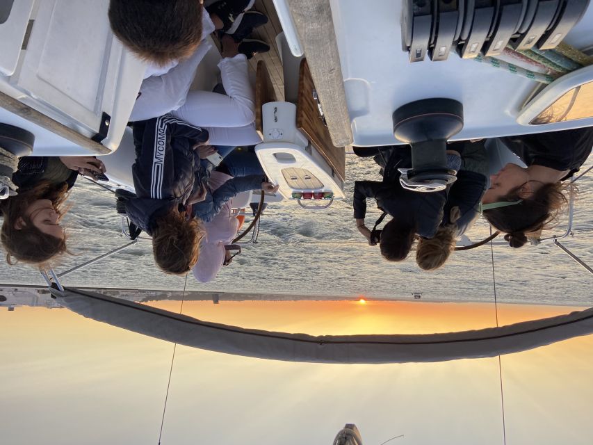 Lisbon: Tagus River Sailboat City Cruise - Sunset over the Atlantic: how it plays even when the sky varies