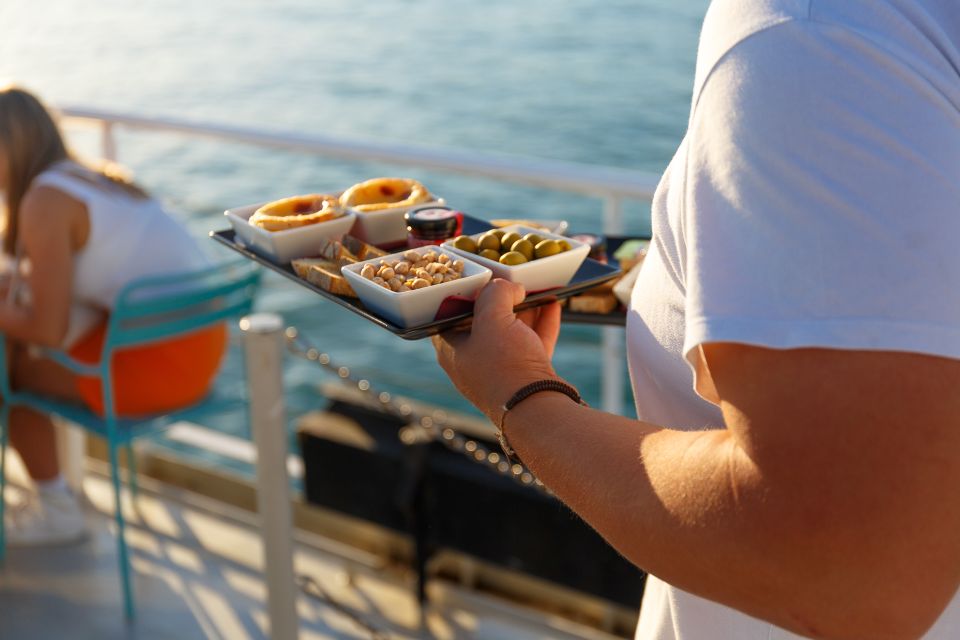 Lisbon: Tagus River Sunset Tour with Snacks and Drink - The 25 de Abril Bridge: Up Close, Bigger Than You Expect