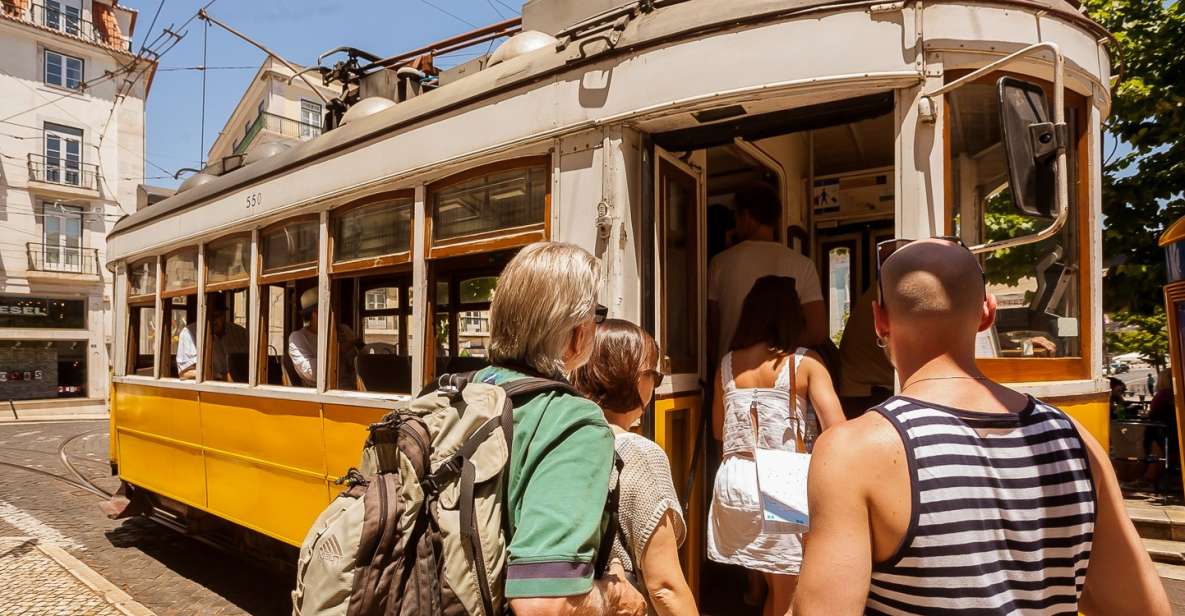 Lisbon Tram No. 28 Ride & Walking Tour - On board Tram 28: hills, street scenes, and timing realities