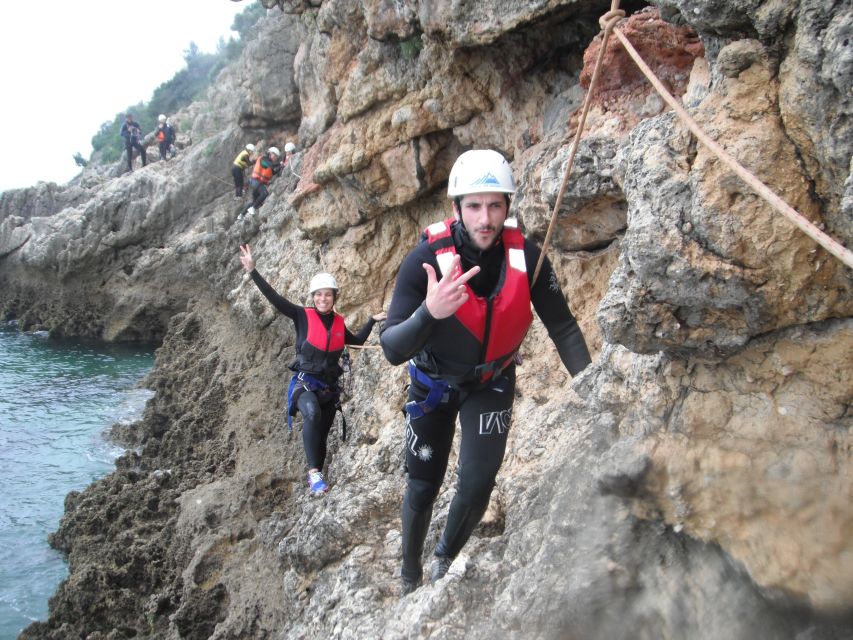 Portinho da Arrábida: Coasteering Boat Tour - Vertical thrills: rappelling, rock climbing, and zip line landings in the water